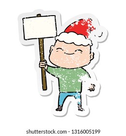 happy hand drawn distressed sticker cartoon of a bald man wearing santa hat