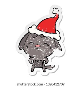 happy hand drawn distressed sticker cartoon of a dog wearing santa hat