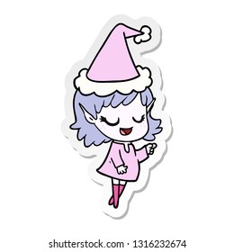 happy hand drawn sticker cartoon of a elf girl pointing wearing santa hat