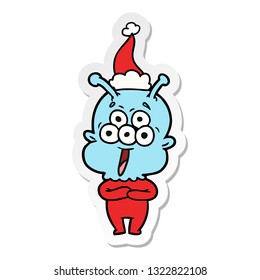 happy hand drawn sticker cartoon of a alien wearing santa hat