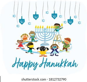 Happy Hanukkah, Jewish Festival of Lights. Diverse group of kids celebrating Hanukkah while wearing face masks during the Coronavirus (Covid-19) pandemic. 