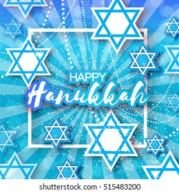 Happy Hanukkah with origami blue Magen David stars.