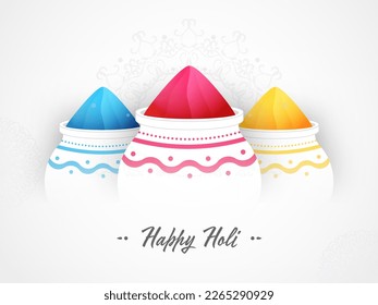 Feliz Concepto De Celebración De Holi Con Tres Potes Llenos De Polvo De Color (Gulal) Sobre El Fondo De Mandala Blanca.