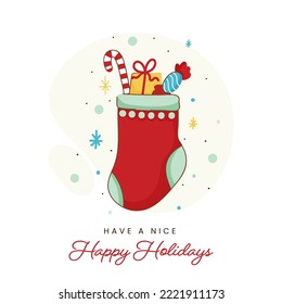 Happy Holidays Greeting Card With Sock Full Of Candy Cane, Gift Box And Toffee Against White Background.