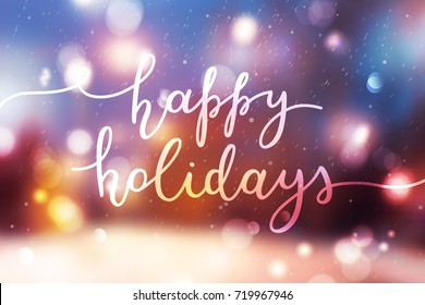 happy holidays lettering, vector handwritten text on blurred background of winter street