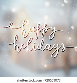 happy holidays lettering, vector handwritten text on blurred winter background