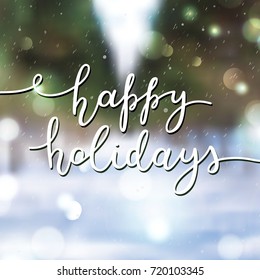 happy holidays lettering, vector handwritten text on blurred background of park alley
