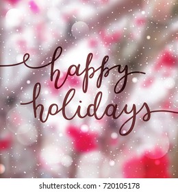 happy holidays lettering, vector handwritten text on blurred background of rowan