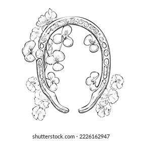 Happy horseshoe with clover sketch hand drawn engraving style vector illustration.