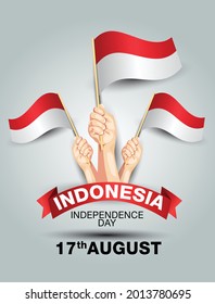 happy independence day Indonesia 17th august. hands holding with Indonesian flag. vector illustration design.