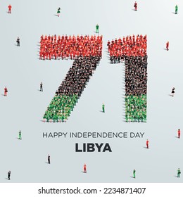 Feliz Día de la Independencia Diseño de Libia. Un gran grupo de personas se forman para crear el número 71 mientras Libia celebra su 71° Día de la Independencia el 24 de diciembre.