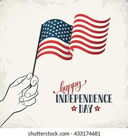 Happy Independence Day. Men's hand holding USA flag with text on retro background. USA Independence Day banner in vintage style.