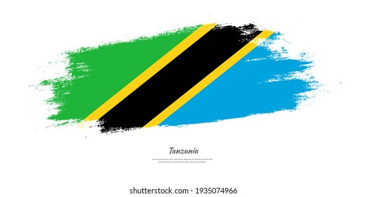 Happy independence day of Tanzania with national flag on artistic stain brush stroke background