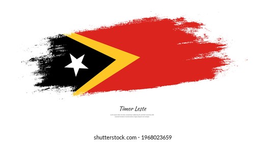 Feliz día de la independencia de Timor Oriental con bandera nacional sobre el fondo artístico de pincel de mancha
