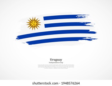 Happy independence day of Uruguay with national flag on grunge texture