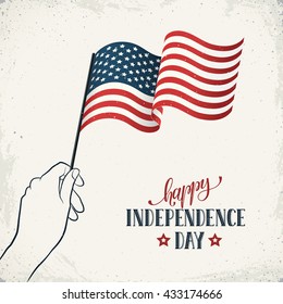 Happy Independence Day. Women's hand holding flag of USA with text on retro background. USA Independence Day banner in vintage style.