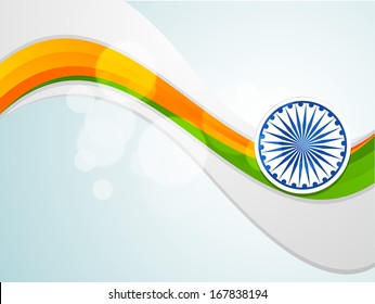 Happy Indian Republic Day concept with shiny wave in national flag color  and ashoka wheel on blue background. 