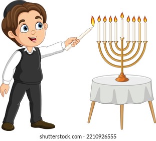 Happy jewish boy lights hanukkah candles