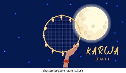 Happy Karwa Chauth festival card with a hand holding a traditionally ornate sieve in the night sky with the moon.
