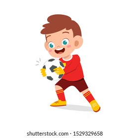 happy kid boy play soccer as goalkeeper