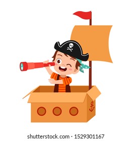 happy kid boy play toy ship cardboard