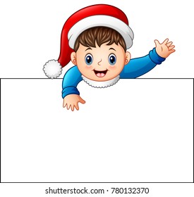 Happy kid wearing santa cap holding blank sign