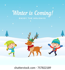 Happy Kids Boy and Girl Playing with Dressed Reindeer at Winter Season in Snowy Ground Background. Holiday Greeting Card, Banner, Poster Template.