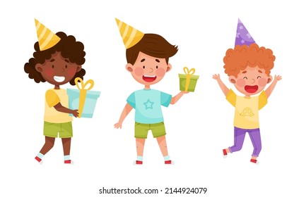 Happy kids celebrating birthday set. Boys and girl in party hats holding gift boxes cartoon vector illustration