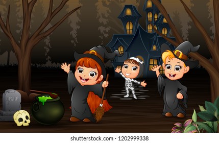 Happy kids celebration halloween day with haunted house background