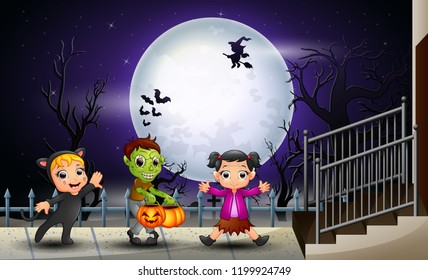 Happy kids halloween in the full moon background