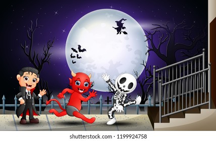 Happy kids halloween in the full moon background
