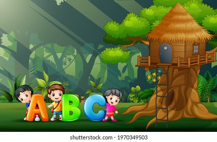 Happy kids holding ABC text in the park