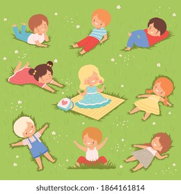 Happy Kids Lying Down on Green Lawn Set, Cute Boys and Girls Having Fun Outdoors Cartoon Vector Illustration