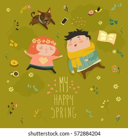 Happy kids lying on the meadow grass full of spring flowers