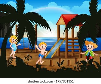 Happy kids playing in playground near the beach