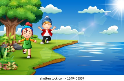 Happy kids playing in the riverside