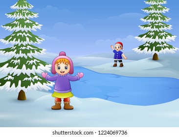 Happy kids playing in the winter landscape with frozen lake and fir trees
