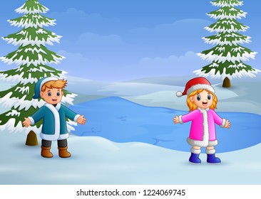 Happy kids playing in the winter landscape with frozen lake and fir trees