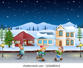 Happy kids running in the snowy village