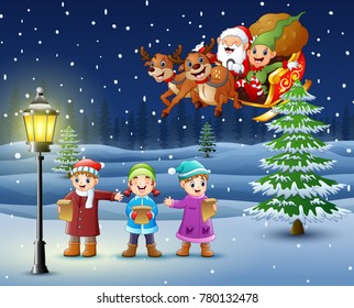 Happy kids singing in the snowing village with santa flyng over them
