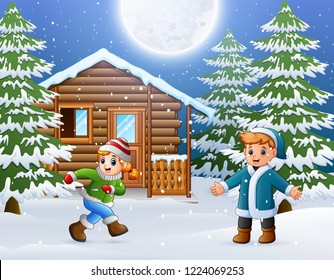 Happy kids to wear winter clothes and play in front of a snowy wooden house