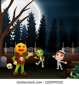 Happy kids wearing a halloween costume in the full moon background