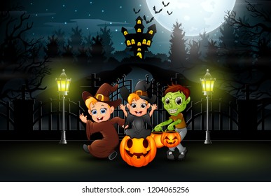 Happy kids wearing halloween costume outdoors at night