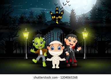 Happy kids wearing halloween costume outdoors at night