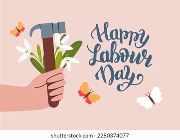 Happy Labour Day Greeting card. Hammer and a bouquet of snowdrops in your hand.