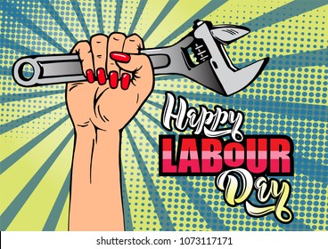 Happy Labour Day lettering. Cartoon female hand with manicure holds adjustable wrench. Typography vector design for greeting cards and poster. Design template celebration. Vector illustration.