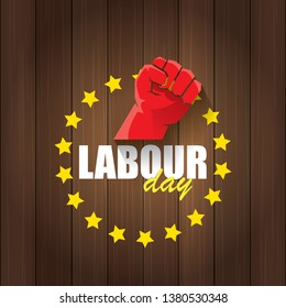 Happy labour day vector label with strong orange fist in the air on wooden background. vector happy labor day background or banner with man hand. workers may day poster