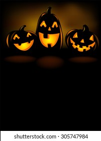 Happy laughing Halloween lanterns in the dark. 