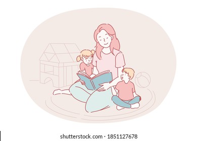 Happy leisure and activities at home with children concept. Young woman mother cartoon character sitting on carpet together with son and daughter and reading book for them at home. Relax, rest, family