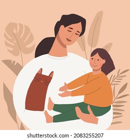 Happy leisure and activities at home with children concept. Young woman mother playing  together with her small daughter at home. Mother holding baby in arms. Relax, rest, family. 
